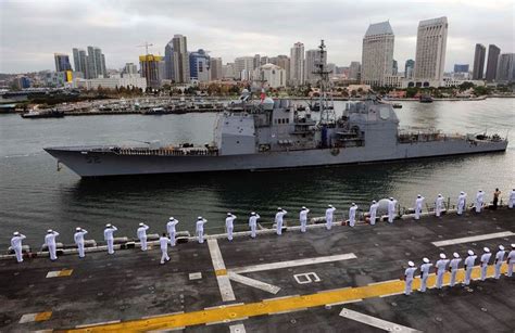 Sailors And Marines Man The Rails And Render Proper Honors As Uss Boxer