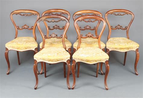 A Set Of Victorian Bleached Rosewood Balloon Back Dining Chairs With