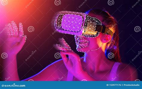 Young Woman Wearing Vr Headset Using Futuristic Interface Stock Photo