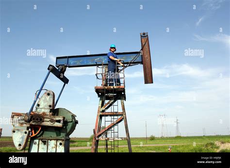 Oil Worker And Pump Jack Industry Scene Stock Photo Alamy