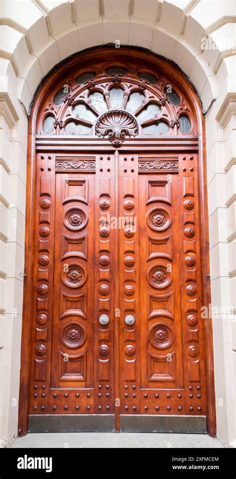 The door is made of wood and has a fancy design on it. The door has two ...