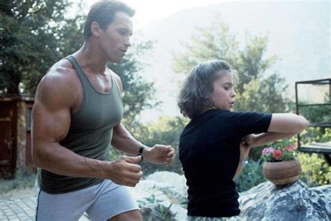 Arnold Schwarzenegger And Alyssa Milano Rehearsing On Set Of The Film