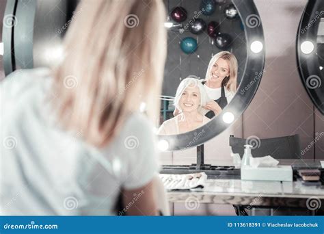 Happy Elderly Woman Looking Into The Mirror Stock Image Image Of Aged