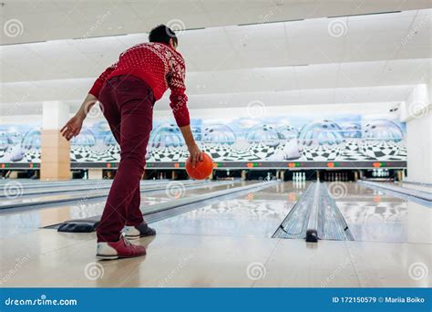 Bowling Game Man Having Fun Playing Bowling In Club Throwing Ball On