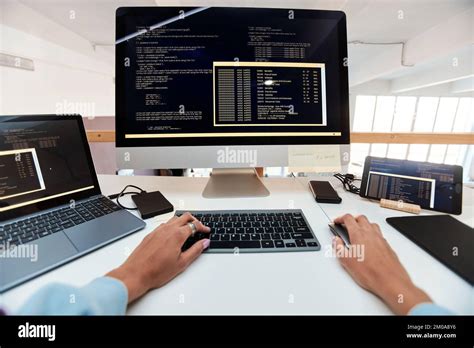 First Person View Of Female Software Developer Coding On Computer Stock