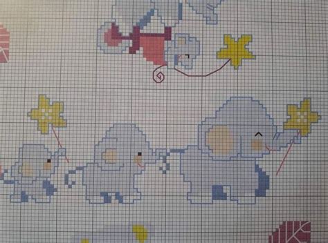 A Cross Stitch Pattern With Elephants And Stars