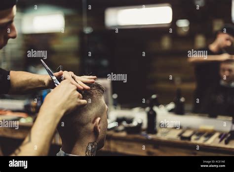 Crop Barber Doing Haircut For Client Stock Photo Alamy