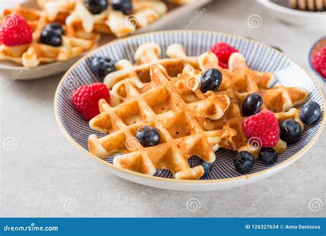 Traditional Homemade Belgian Waffles With Fresh Berries And Syrup Stock