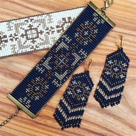 Two Pieces Of Beaded Jewelry Sitting On Top Of A Wooden Table Next To