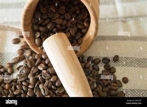 coffee beans with mortar and pestle Stock Photo - Alamy