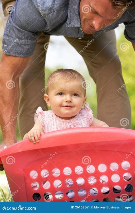 Father Carrying Baby Girl In Laundry Basket Stock Image Image Of