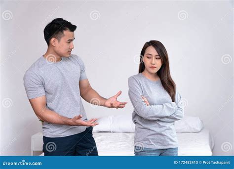 Unhappy Asian Couples Standing Beside Each Other And Women Avoid