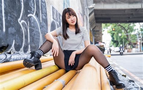 K K Asian Pose Sitting Brunette Girl Hands Legs Boots