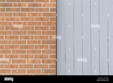 Brick wall and wooden fence texture background Stock Photo - Alamy