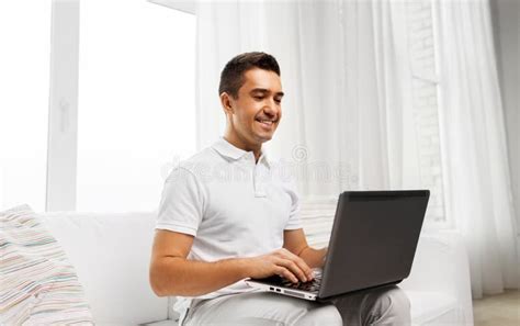 Happy Man With Laptop Computer At Home Stock Photo Image Of Internet