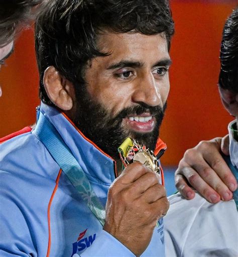 Bajrang Punia Defends Title Sakshi Reverses Losing Trend To Earn