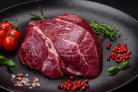 Premium Photo Fresh Raw Beef Steak With Salt Spices And Herbs