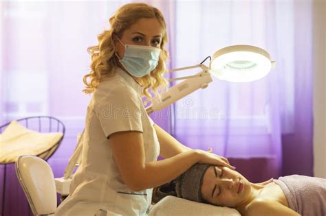 Beautiful Woman In Spa Salon Getting Face Treatment Stock Photo Image