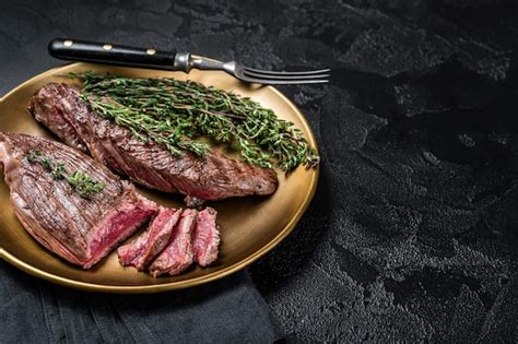 Premium Photo Bbq Grilled Bavette Bavet Beef Meat Steak With Herbs On A Plate Black Background