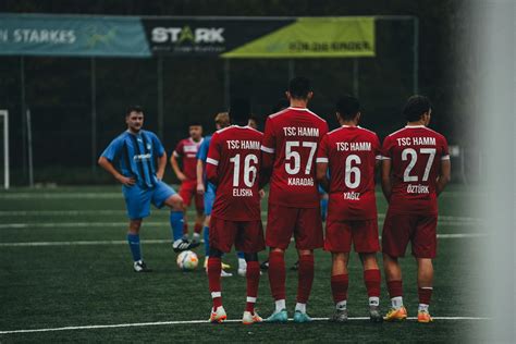 Soccer Players Lining Up for Free Kick on FieldFree Stock Photo