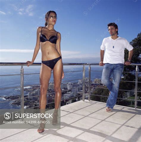 Man Admiring Woman In Bikini SuperStock