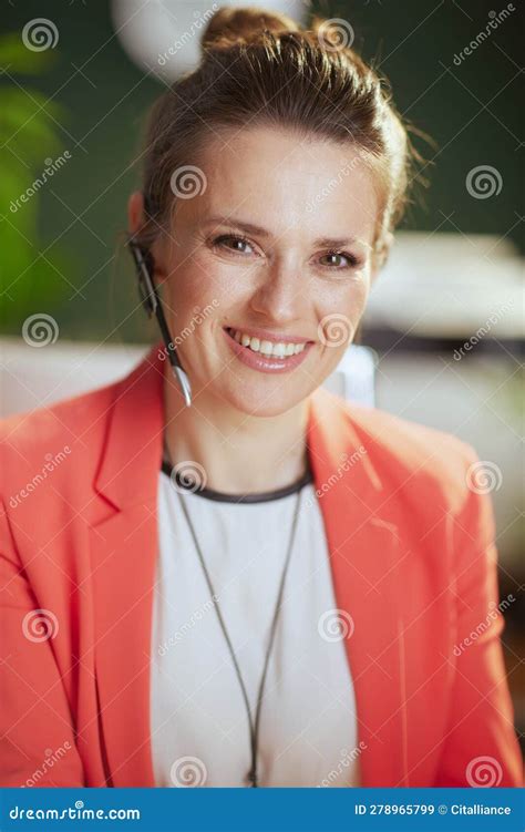 Portrait Of Happy Modern Business Woman In Modern Green Office Stock