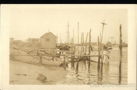 Boats On The Shore Canoes And Rowboats Postcard