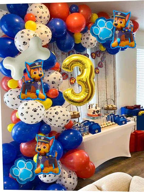 A Birthday Party With Balloons And Paw Patrol Decorations