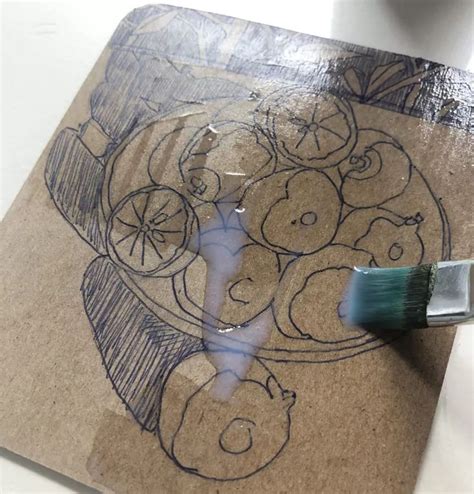 A Drawing On A Piece Of Cardboard With A Brush