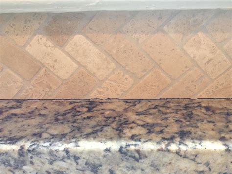 kitchen counters - How to caulk stone backsplash to granite countertop ...