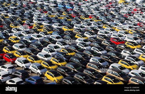 Large Parking Lot Of New Cars Waiting For Delivery And Export At