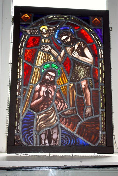 Stained Glass Window Depicting The Baptism Of Jesus The Holy Spirit In The Shape Of A Dove And