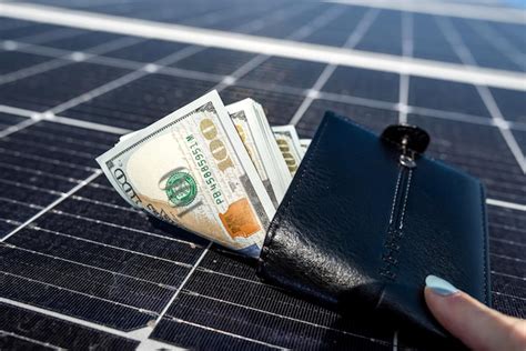 Premium Photo Money Dollars In Wallet Above Solar Panel Dollar Bills