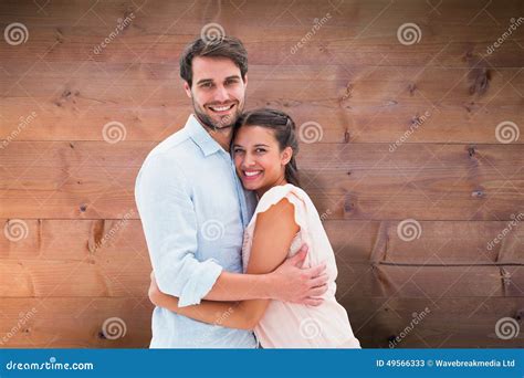 Composite Image Of Attractive Young Couple Hugging And Smiling At