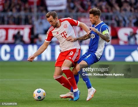 Harry Kane L Of Bayern Munich Vies With Tobias Kempe Of Darmstadt News Photo Getty Images