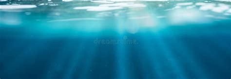 Blue Underwater With Sunlight Shining Through Water Surface In Tropical