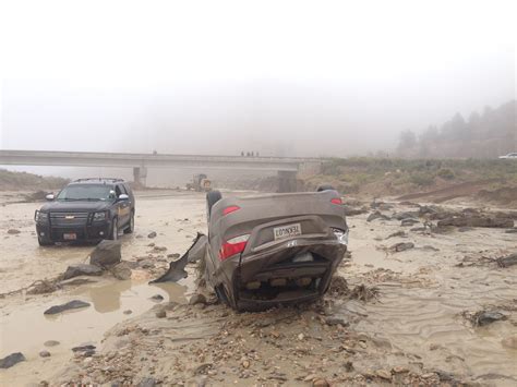 Couple Rescued After Road Collapse Sends Car Plunging Into River