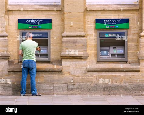 Person Using Cash Dispenser Stock Photo Alamy