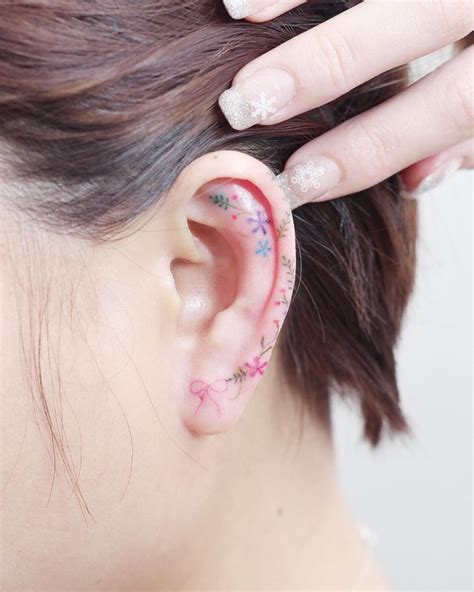 Minimalist Flower Tattoos On The Left Ear