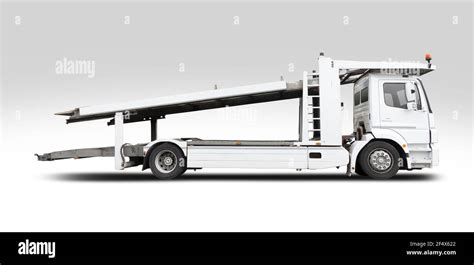 Empty car carrier truck side view isolated on white Stock Photo - Alamy