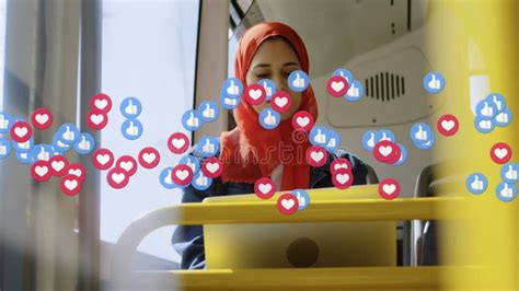 Animation Of Falling Social Media Icons And Emojis Over Woman In Hijab