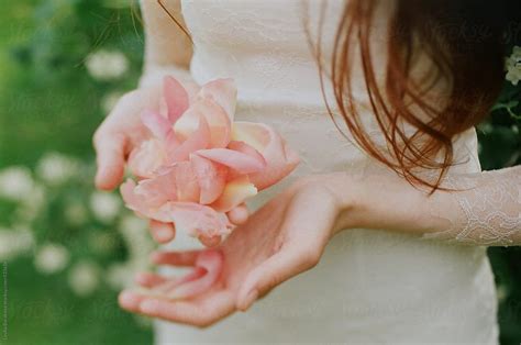 Girl Holding On Peony Petals By Stocksy Contributor Amor Burakova