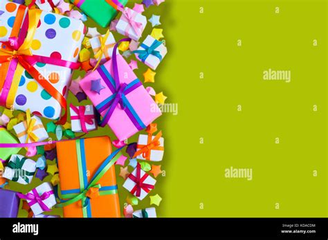 Colored Gift Boxes With Colorful Ribbons Green Background Gifts For