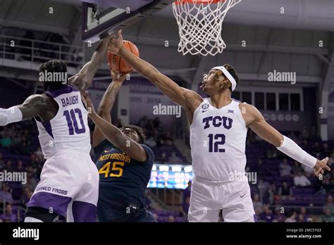 TCU Guard Damion Baugh 10 And Forward Xavier Cork 12 Defend Against