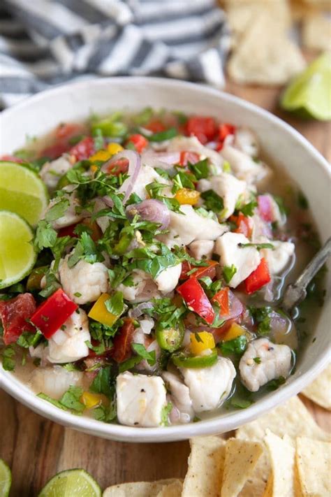 Large White Shallow Bowl Filled With Fish Ceviche And Garnished With