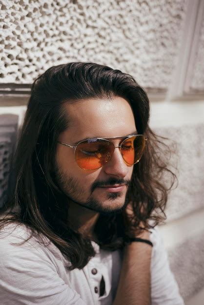 Premium Photo Portrait Of Young Man Wearing Sunglasses