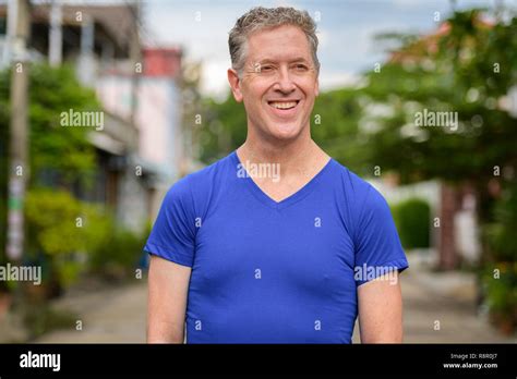 Happy Mature Man Thinking In The Streets Outdoors Stock Photo Alamy