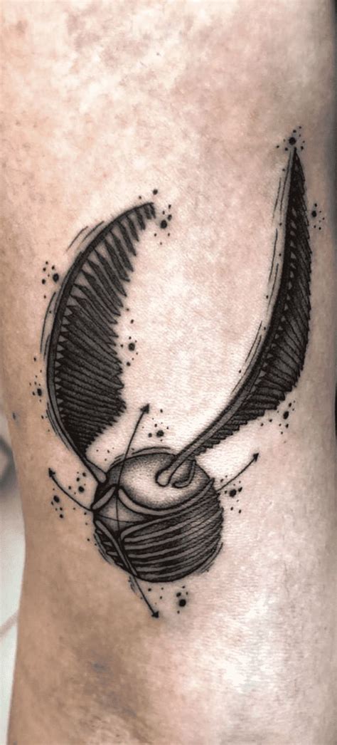 a black and white tattoo on the leg of a person with an object in it