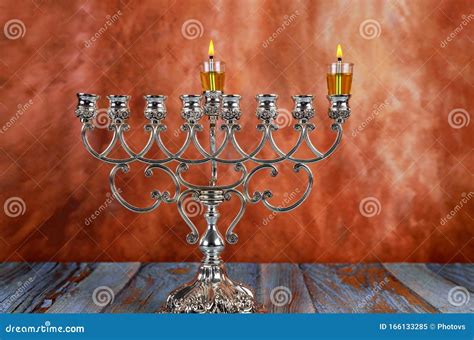 Jewish Holiday Hanukkah With Lighting The First Candle On A Hanukkah Menorah Traditional ...