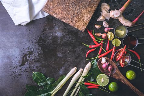 Spices For Use As Cooking Ingredients On A Wooden Background With Fresh